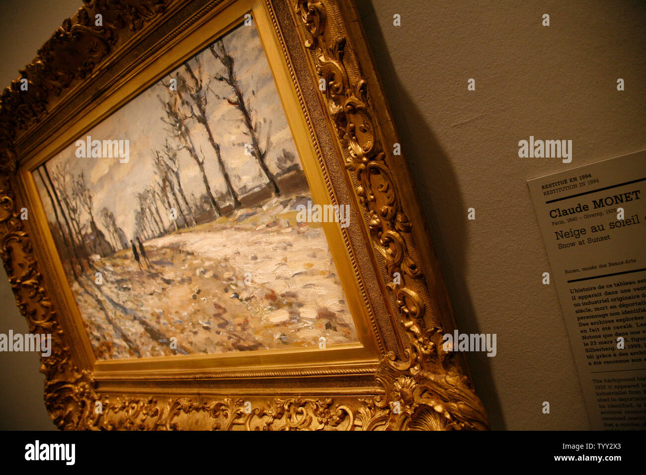 Claude Monet's 'Snow at Sunset' hangs on the wall at the opening of an exhibition in Paris on June 25, 2008.  The exhibition, taking place at the Jewish Art and History Museum, features precious art pieces that were stolen from Jewish homes during the Nazi occupation of France during World War II.   (UPI Photo/David Silpa) Stock Photo