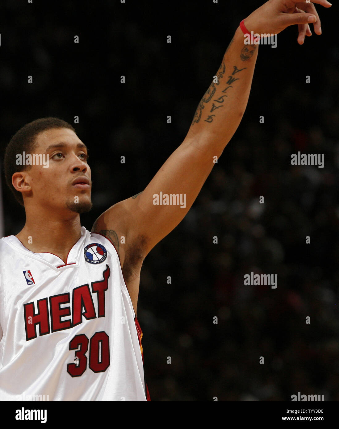Miami Heat rookie forward Michael Beasley follows through after a shot during an NBA preseason game against the New Jersey Nets in Paris on October 9, 2008