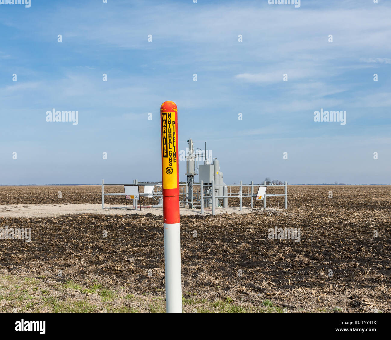 Underground Natural gas pipeline warning sign. Energy infrastructure security, safety and underground utility concept. Stock Photo