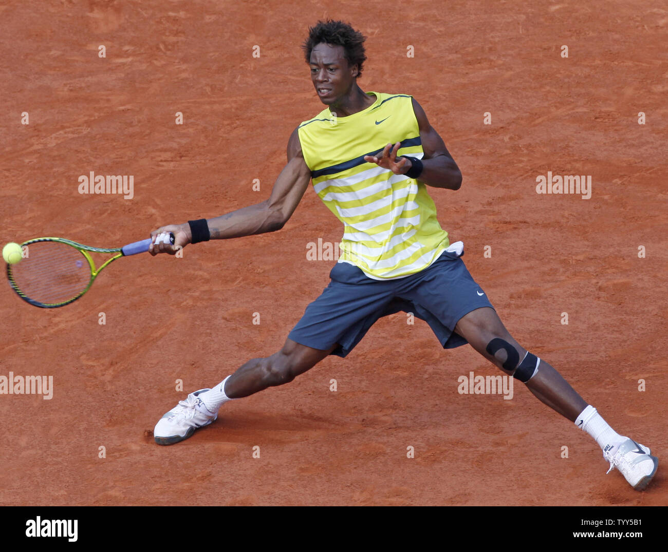 Frenchman Gael Monfils hits a shot during his French Open quarterfinal match  against Roger Federer of