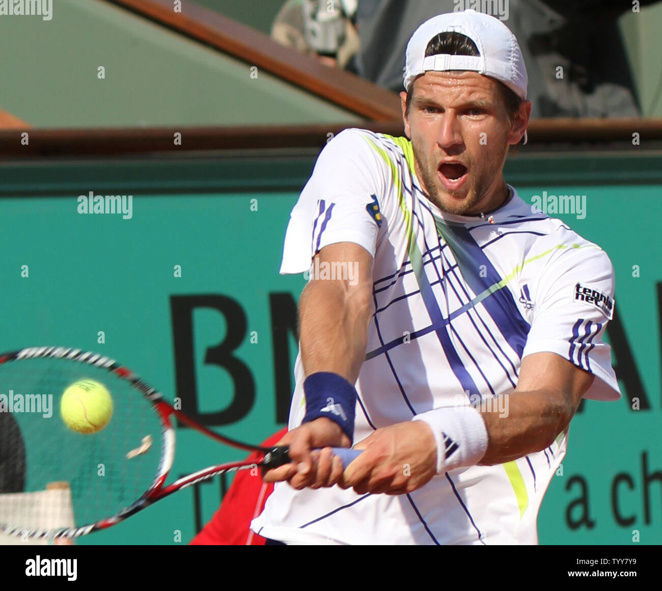 Austrian Jurgen Melzer hits a shot during his French Open semifinal match  against Spaniard Rafael Nadal