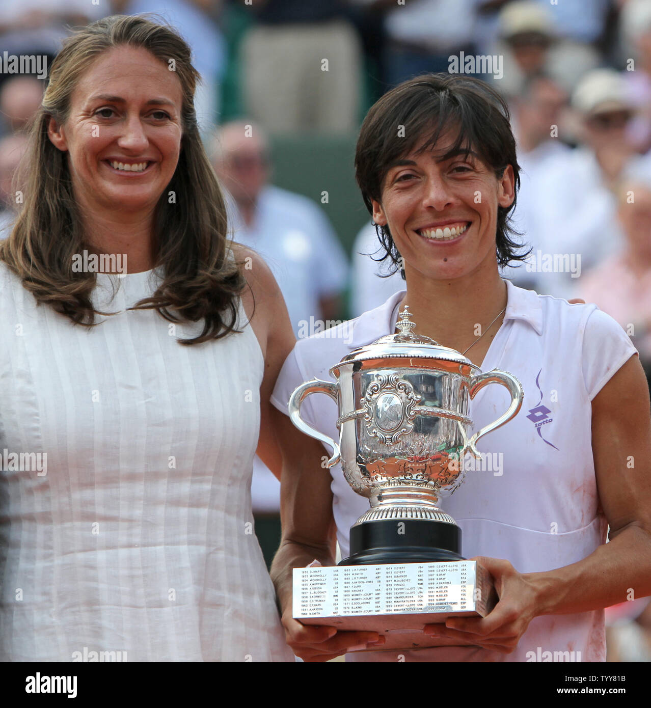 Italian Francesca Schiavone holds the championship trophy next to former tennis player Mary Pierce after Schiavone won her French Open womens final match against Australian Samantha Stosur at Roland Garros in Paris on June 5, 2010.  Schiavone defeated Stosur 6-4, 7-6(2) to become the first Italian ever to win a Grand Slam title.   UPI/David Silpa Stock Photo