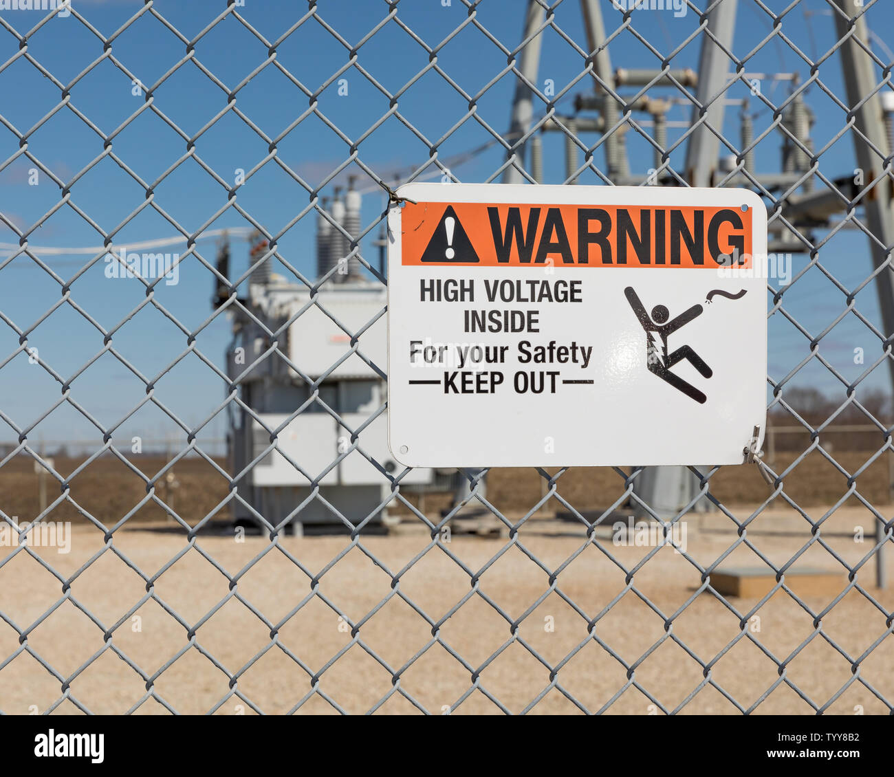High voltage warning sign showing danger of electrocution on a chain