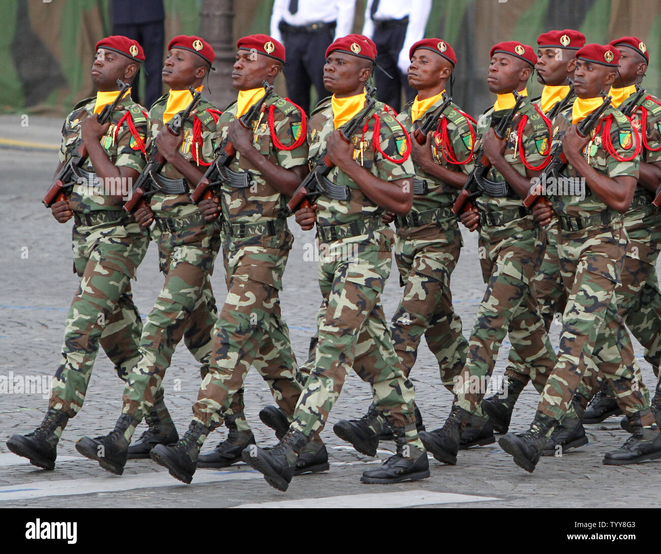 Soldiers march in the annual military parade at the Place de la ...