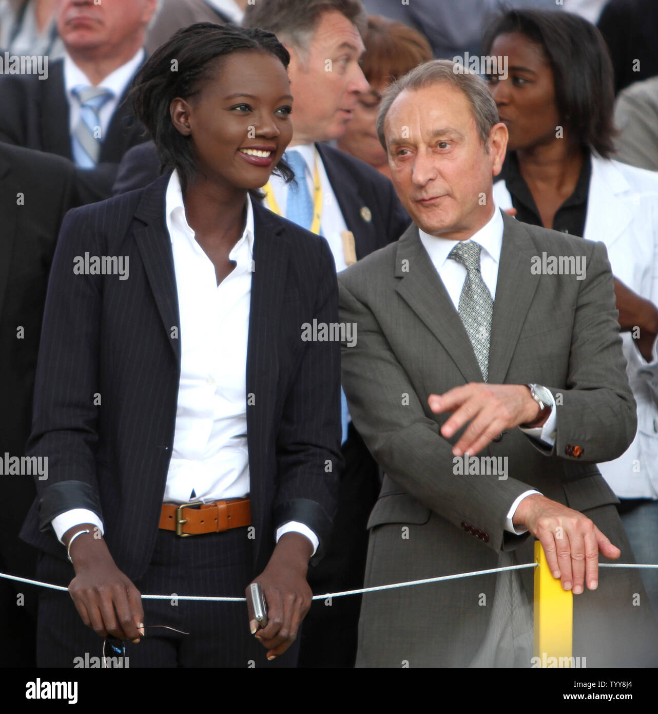 French Secretary of State for Sports Rama Yade (L) and Paris Mayor Bertrand Delanoe await the arrival of the riders on the Champs-Elysees during this year's Tour de France in Paris on July 25, 2010.  Spaniard Alberto Contador won the race, his  third Tour de France title in the last four years.   UPI/David Silpa Stock Photo
