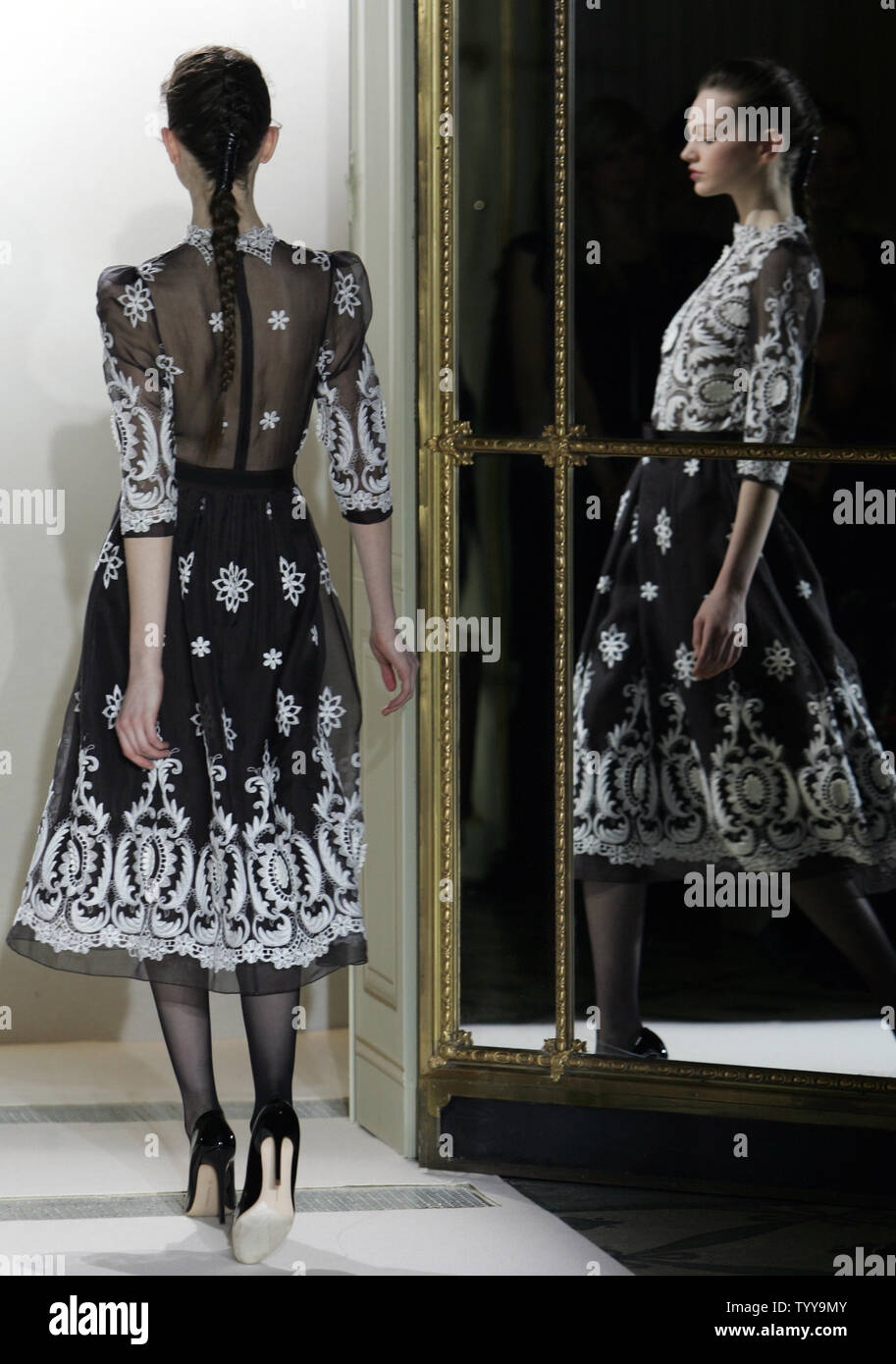 A model wears an outfit during the presentation of Collette Dinnigan's ...