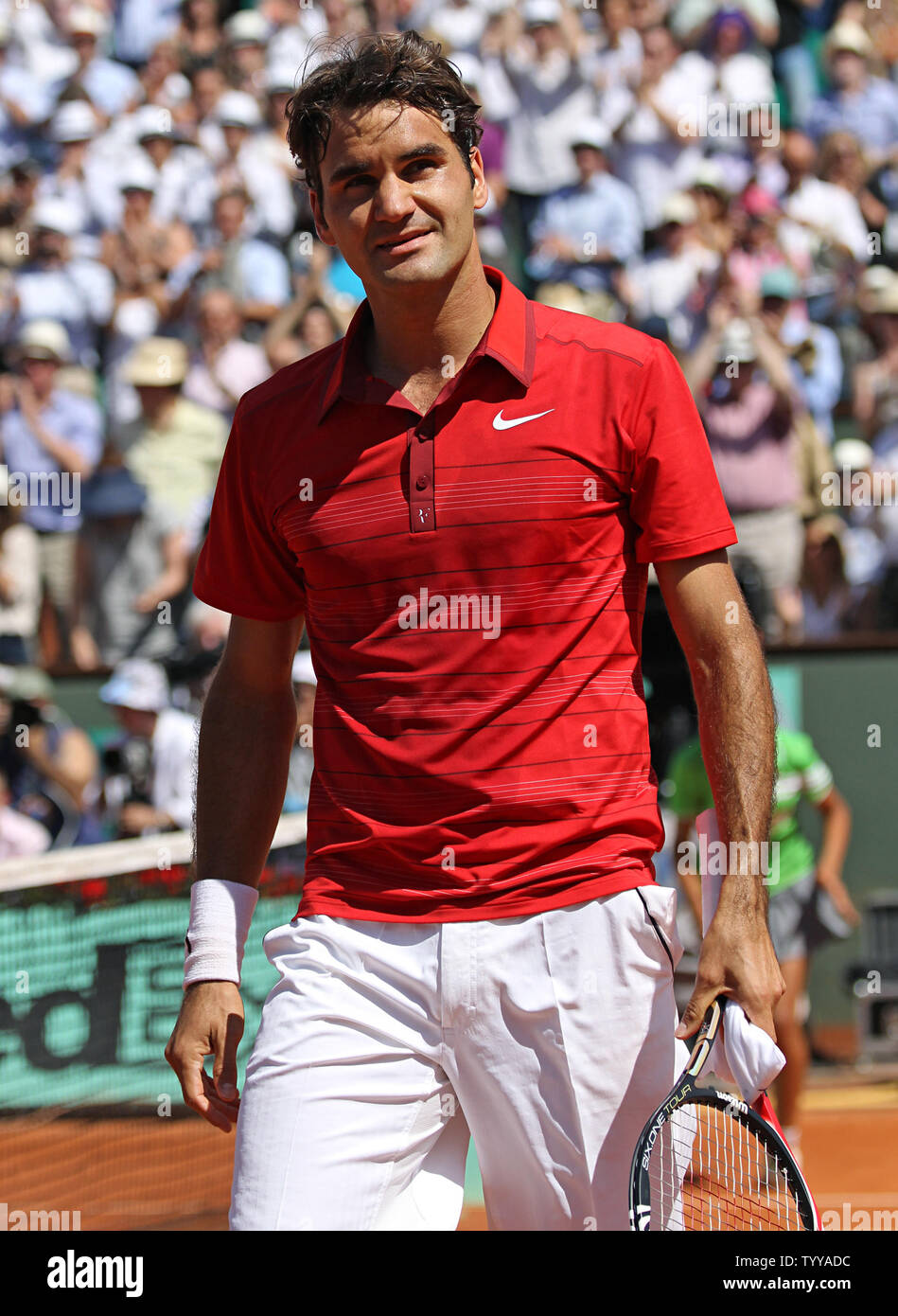 Roger Federer of Switzerland walks off the court after winning his French  Open mens fourth round match against Stanislas Wawrinka of Switzerland at Roland  Garros in Paris on May 29, 2011. Federer