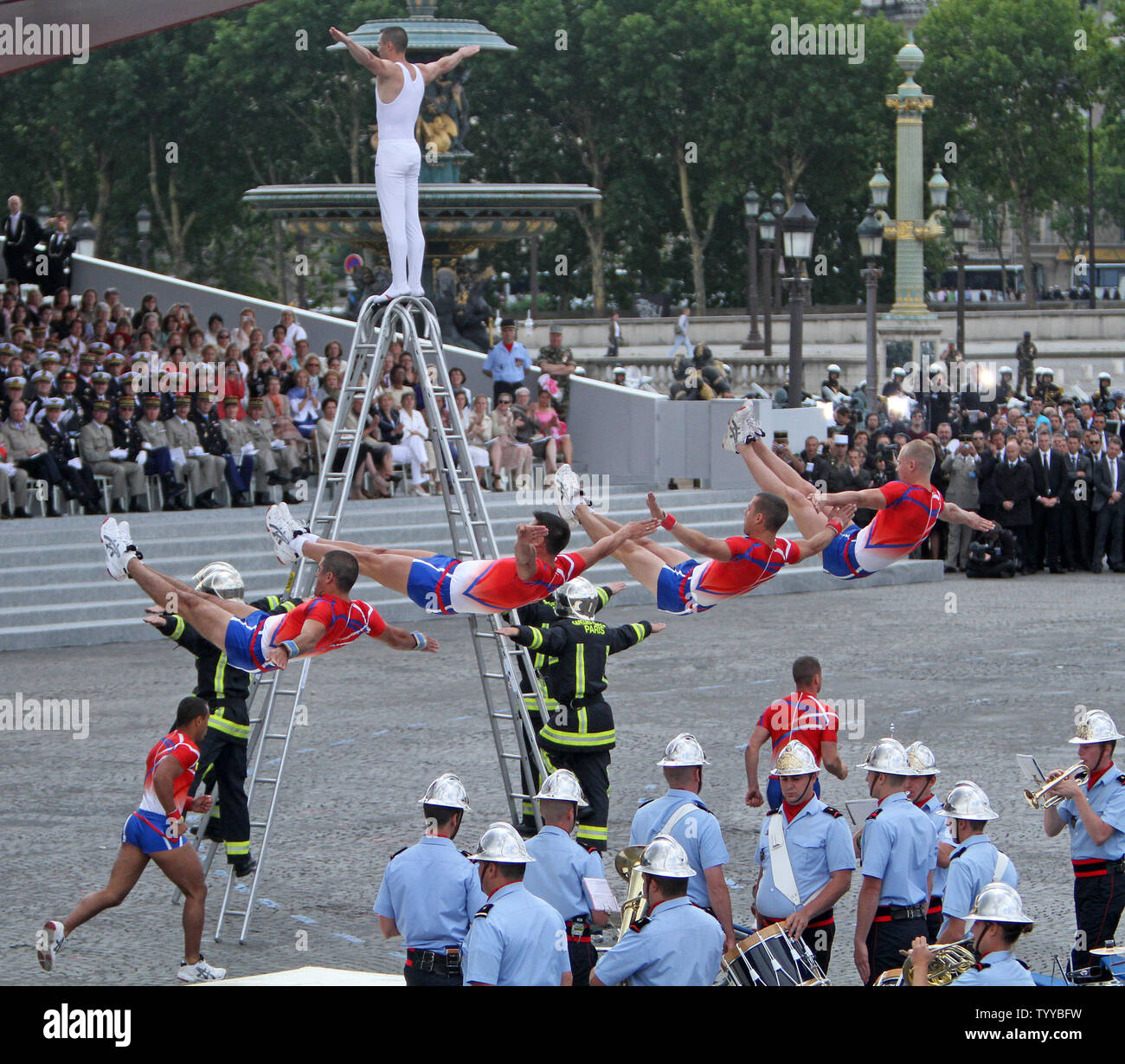 Gymnasts of the Paris fire brigade perform during the Bastille Day annual military parade at the Place de la Concorde in Paris on July 14, 2011. This year's parade highlighted the regiments of the overseas French territories including Guadeloupe, Guyana, Martinique, Reunion, Mayotte, New Caledonia and Polynesia.   UPI/David Silpa Stock Photo