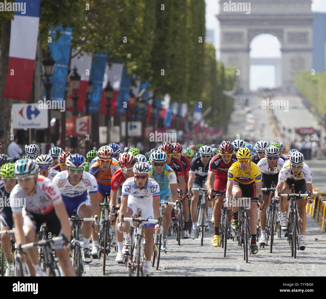 Australian Cadel Evans (yellow jersey) rides along the Champs-Elysees en route to winning his first Tour de France title in Paris on July 24, 2011.  Evans became the first Australian ever to win the Tour de France.   UPI/David Silpa Stock Photo
