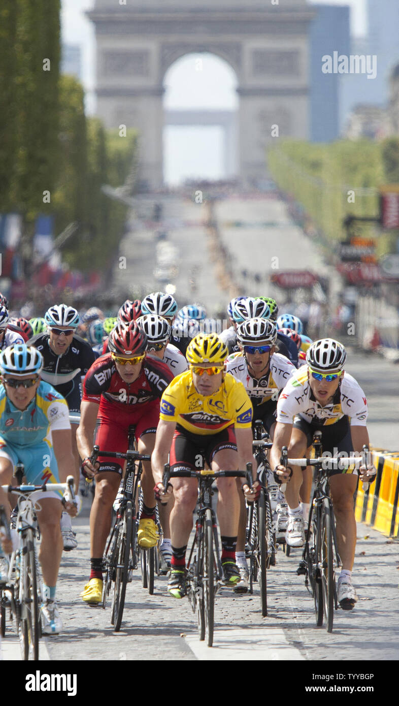 Australian Cadel Evans (yellow jersey) rides along the Champs-Elysees en route to winning his first Tour de France title in Paris on July 24, 2011.  Evans became the first Australian ever to win the Tour de France.   UPI/David Silpa Stock Photo