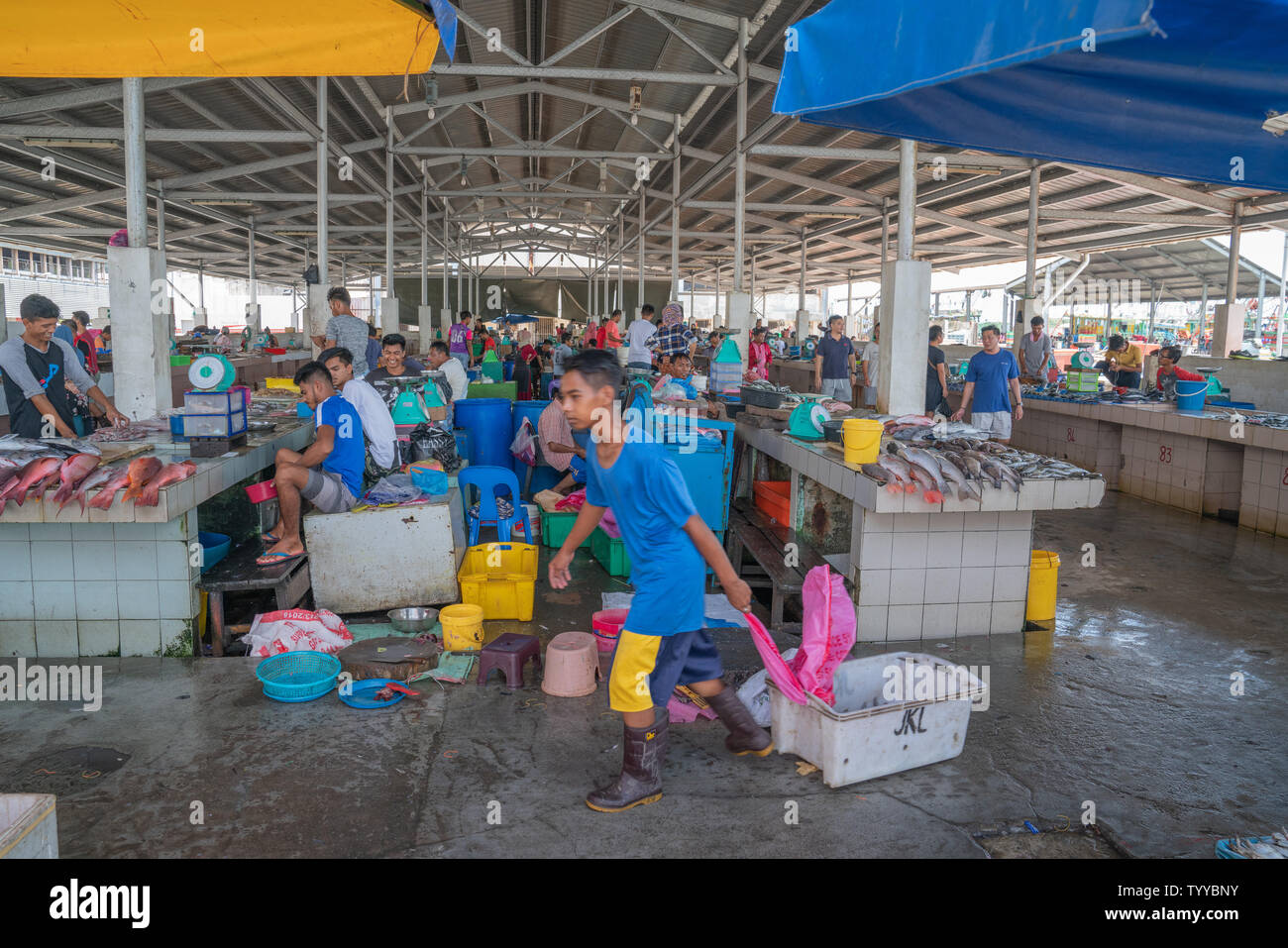 KOTA KINABALU BORNEO MAY 31 2019; Workers, vendors and fresh seafood