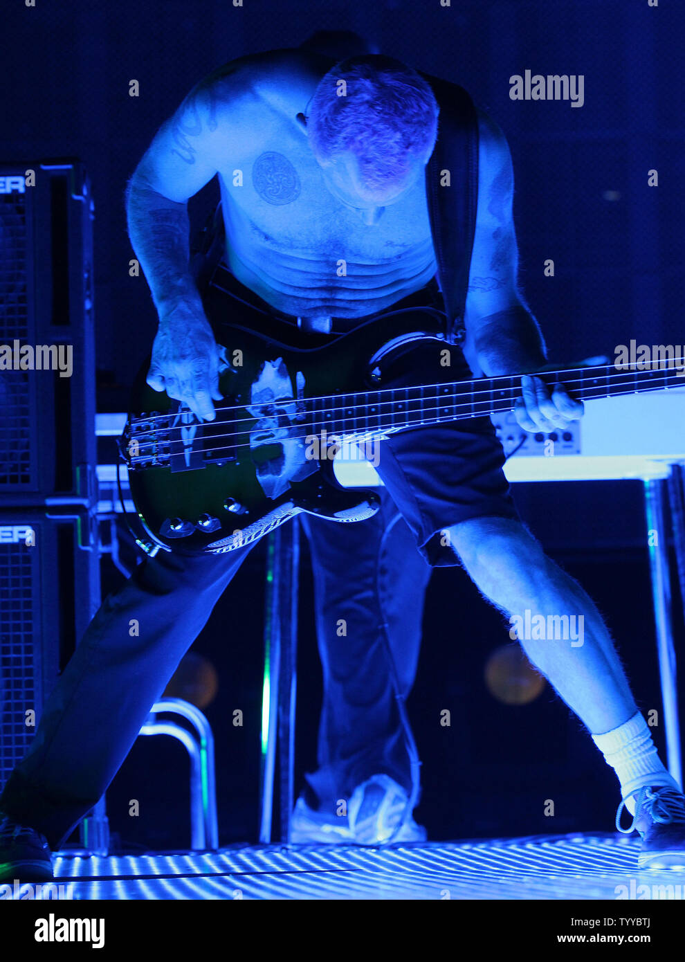 Flea, whose real name is Michael Peter Balzary, plays the bass guitar while performing with the Red Hot Chili Peppers in concert at Bercy in Paris on October 18, 2011.   UPI/David Silpa Stock Photo