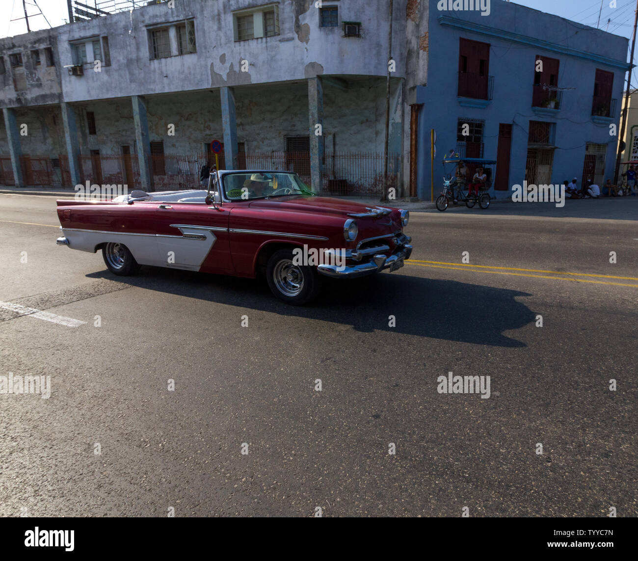 Vintage car driving down Ave. del Puerto in the sunshine Stock Photo