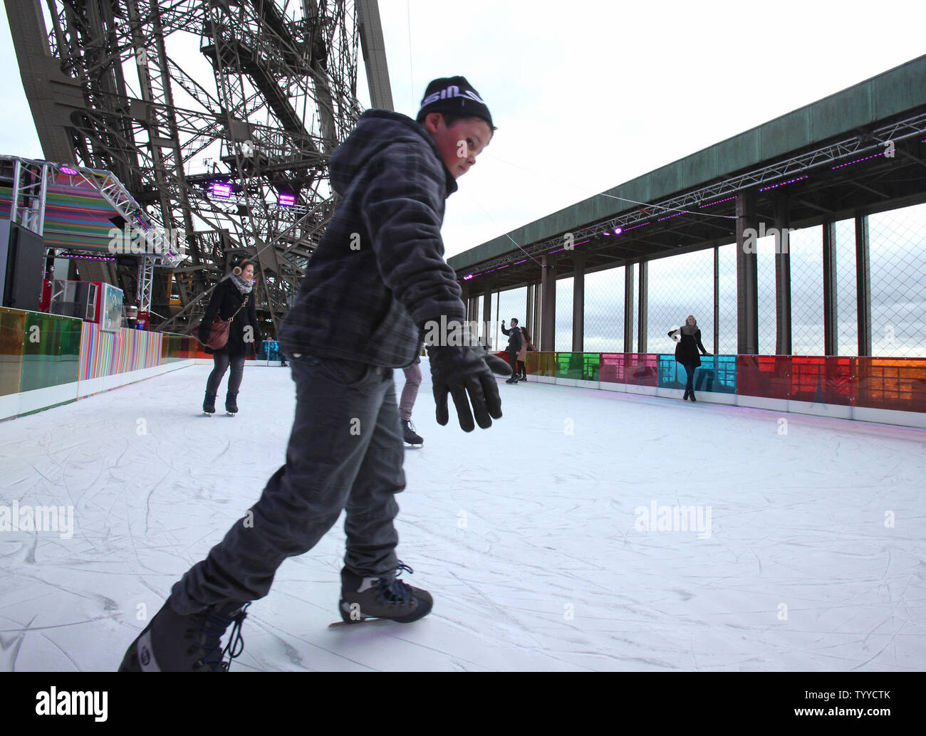 A young boy takes the ice at the opening of an ice skating rink on the first level of the Eiffel Tower in Paris on December 15, 2011.  The rink is open to the public and will remain in place through January 31.   UPI/David Silpa. Stock Photo