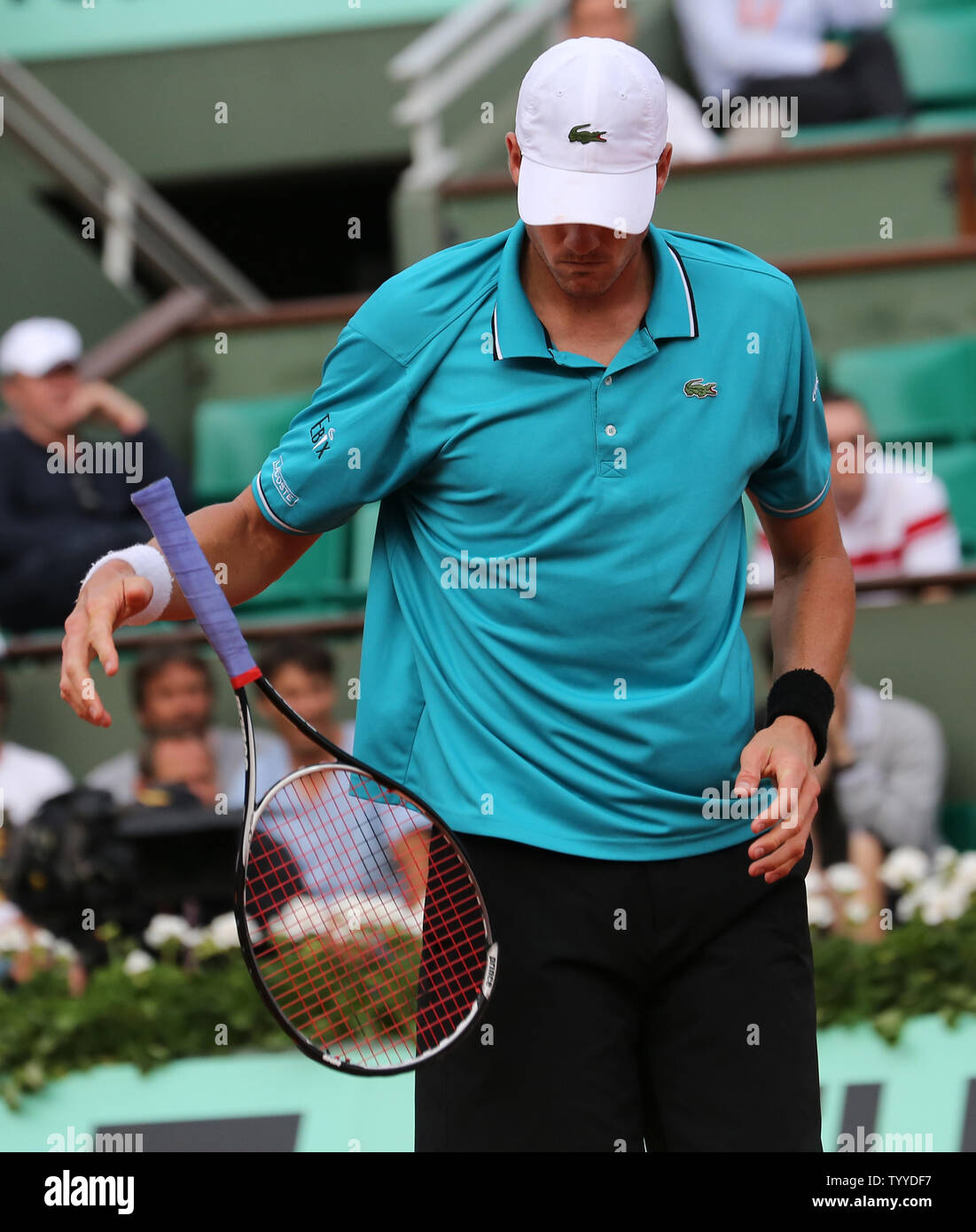 American John Isner throws his racquet in disgust during his French Open  mens second round match against Paul-Henri Mathieu of France at Roland  Garros in Paris on May 31, 2012. The match