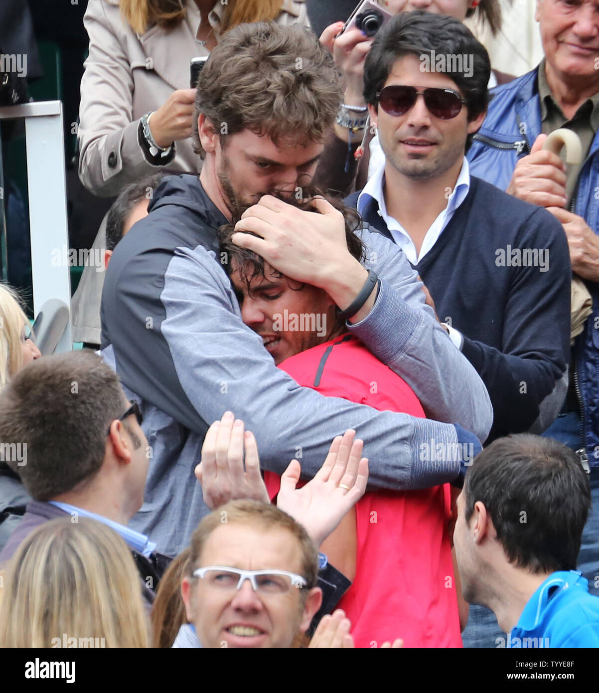 Spaniard Rafael Nadal (red shirt) embraces Los Angeles Laker and fellow  countryman Pau Gasol after Nadal won his French Open men's final match  against Serbian Novak Djokovic at Roland Garros in Paris