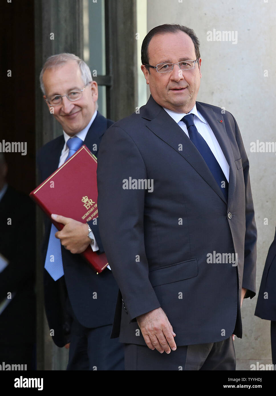 French President Francois Hollande (R) and British Ambassador to France Peter Ricketts await the arrival of British Foreign Secretary William Hague, U.S. Secretary of State John Kerry and French Foreign Minister Laurent Fabius before a meeting on the Syria conflict at the Elysee Palace in Paris on September 16, 2013.    UPI/David Silpa Stock Photo