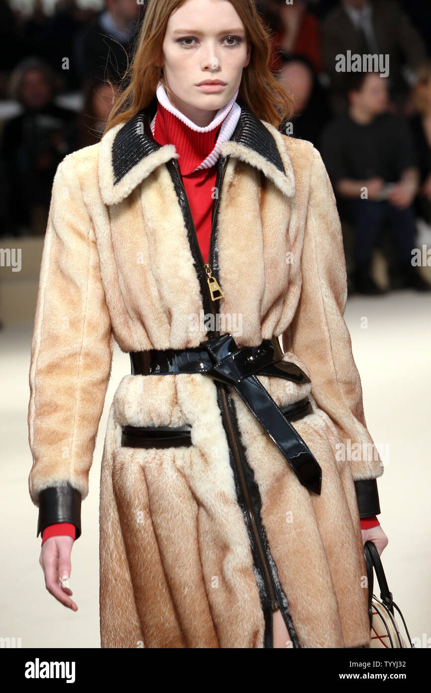 A model takes to the catwalk during the Louis Vuitton fashion show as part  of the
