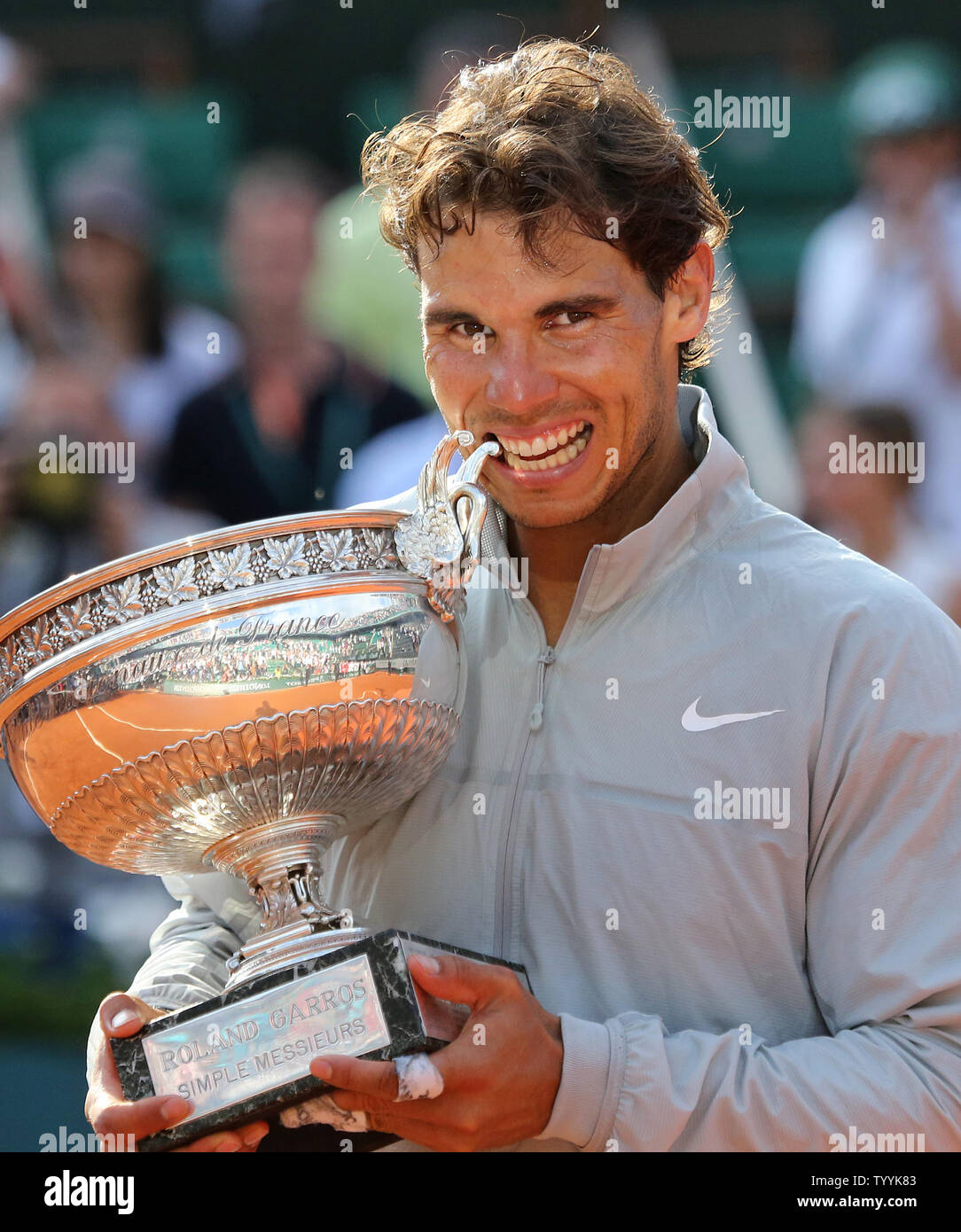 Rafael Nadal of Spain holds the championship trophy after winning his French  Open men's final match against Novak Djokovic of Serbia at Roland Garros in  Paris on June 8, 2014. Nadal defeated