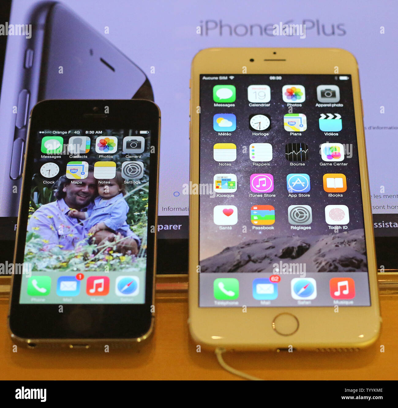 The new iPhone 6 Plus (R) is seen next to an iPhone 5s at the Apple Store  near Place de l'Opera following the release of the next generation models  today in Paris