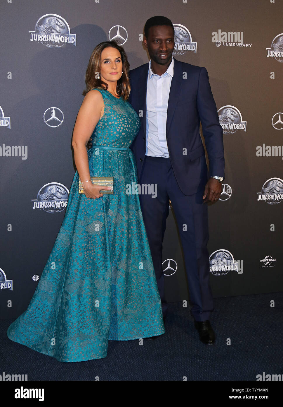 Helene Sy and Omar Sy arrive at the world premiere of the film 'Jurassic World' in Paris on May 29, 2014.   Photo by David Silpa/UPI. Stock Photo