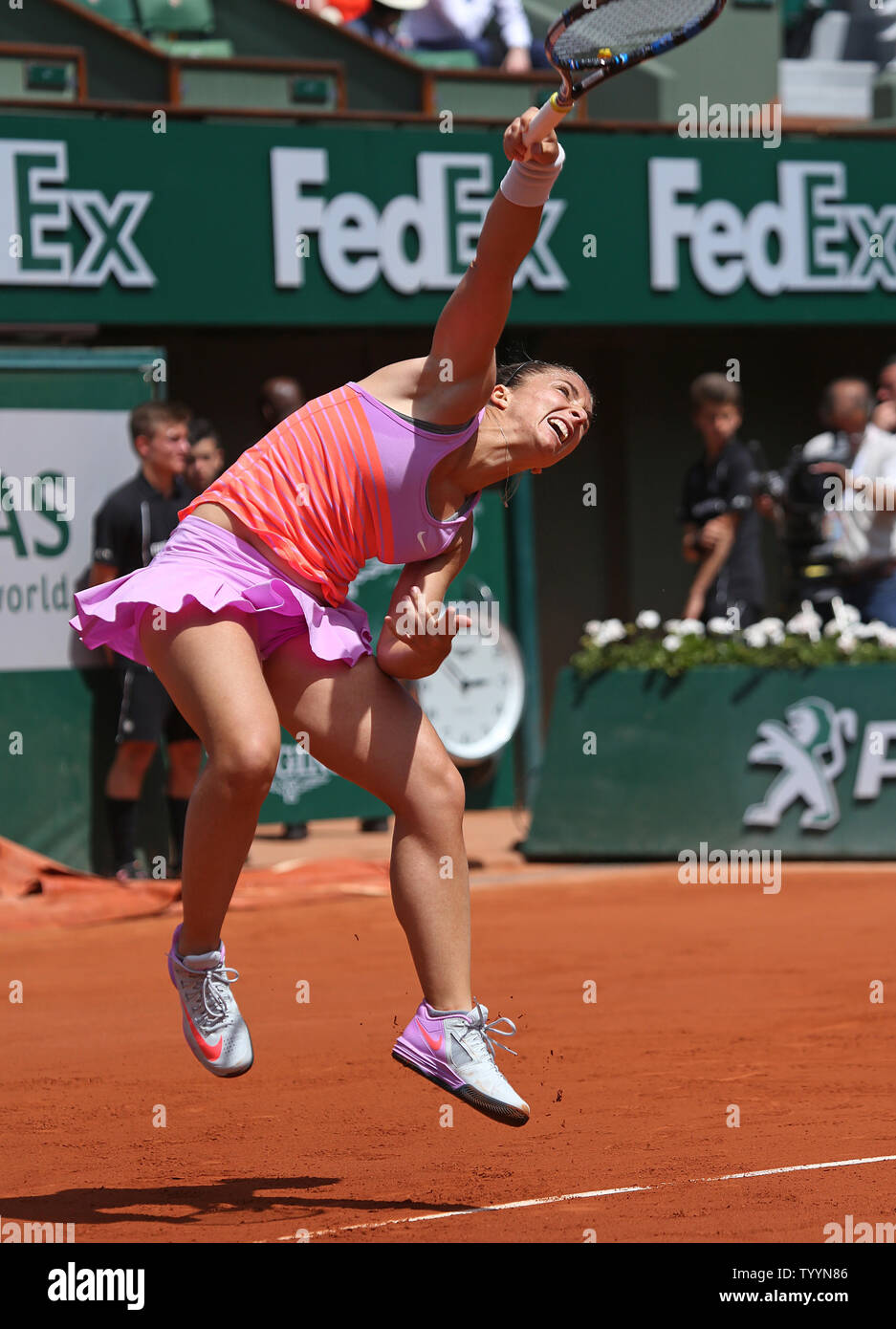 Sara Errani of Italy hits a serve during her French Open women's  quarterfinal match against American Serena Williams at Roland Garros in  Paris on June 3, 2015. Williams defeated Errani 6-1, 6-3