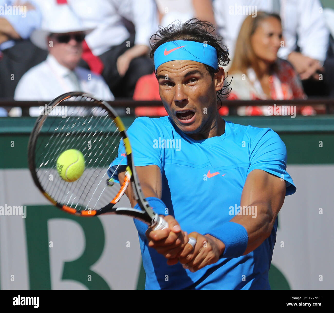 Rafael Nadal of Spain hits a shot during his French Open men's quarterfinal  match against Novak Djokovic of Serbia at Roland Garros in Paris on June 3,  2015. Djokovic defeated Nadal 7-5,