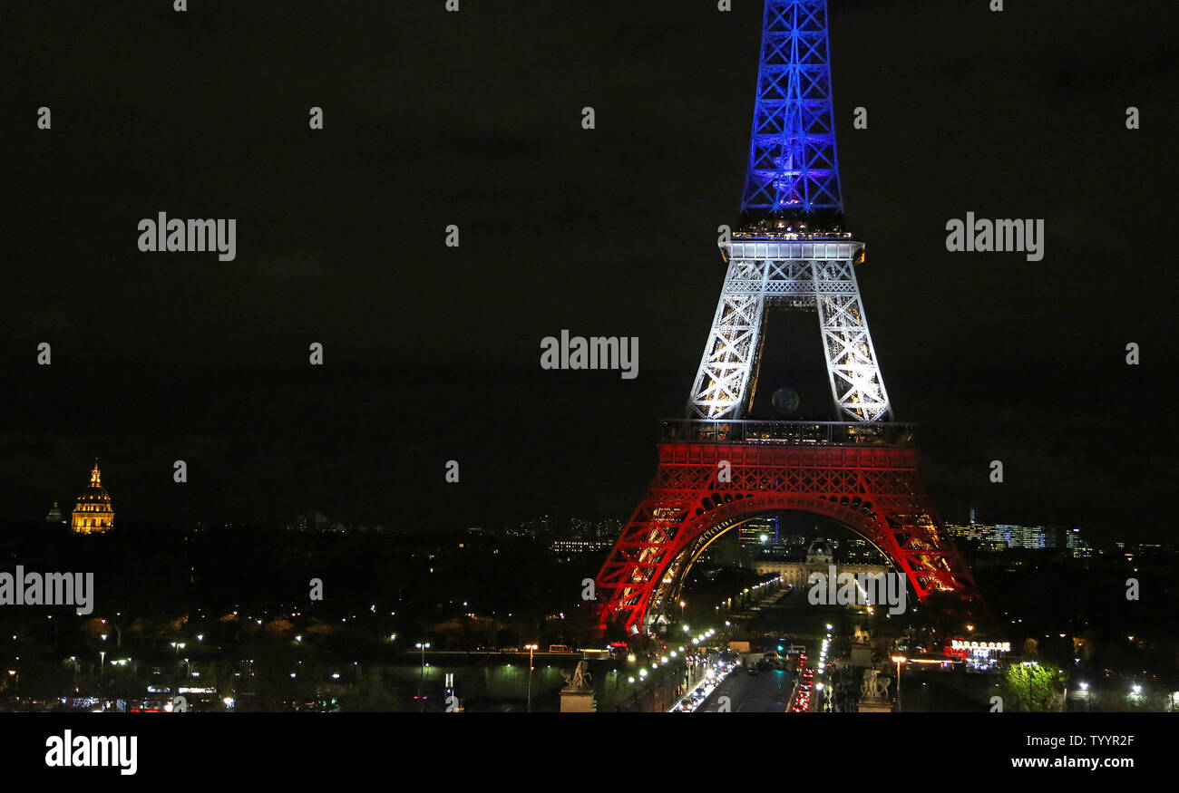 The Eiffel Tower Is Illuminated In The Colors Of The French Flag