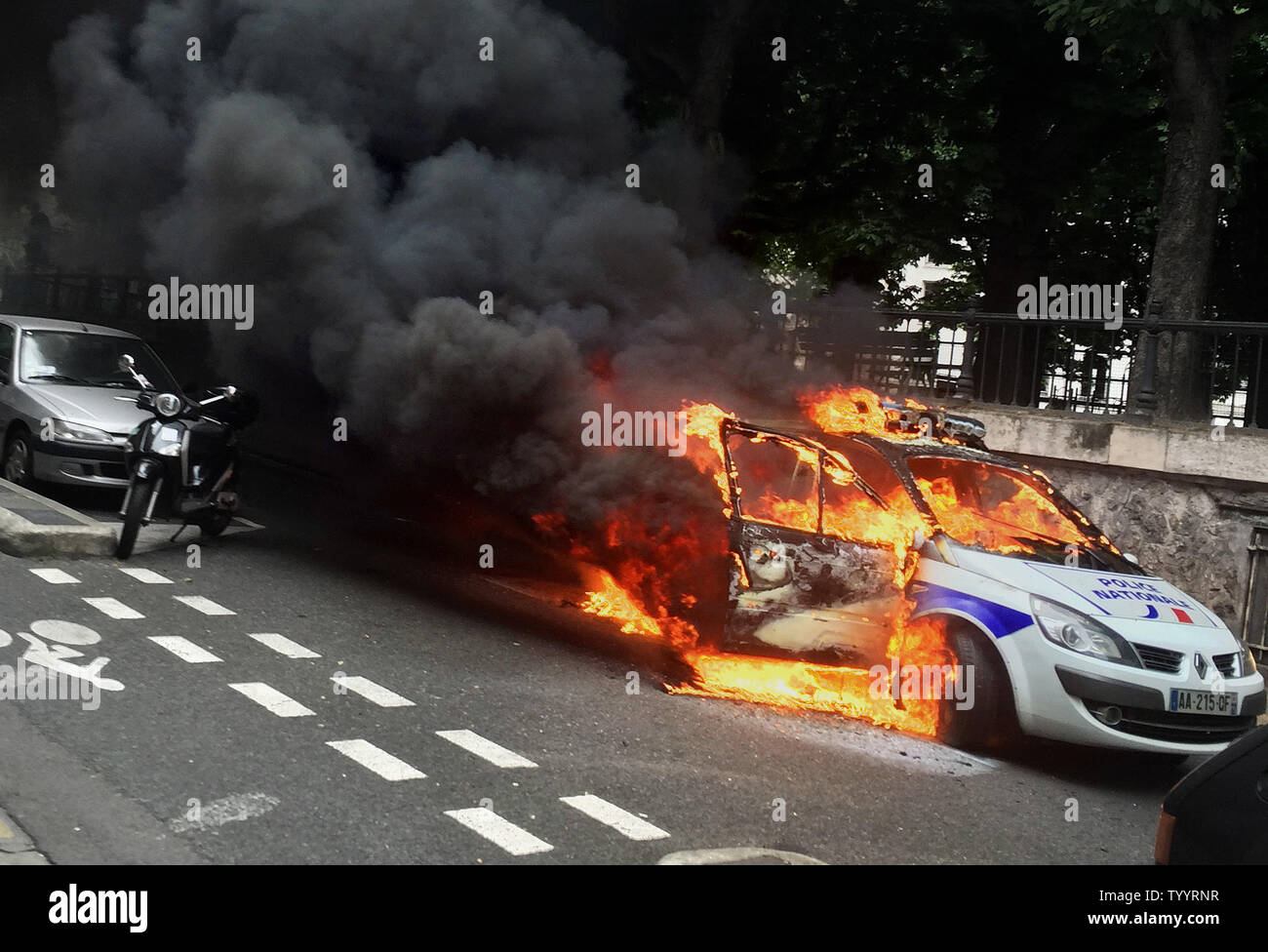 Smoke bellows from a burning police car after it was set ablaze in Paris on the sidelines of a police demonstration against anti-cops hatred on May 18, 2016. Police led countrywide protests to denounce the violence they faced during recent social movements in which some 350 security forces were injured.   Photo by Eco Clement/UPI Stock Photo
