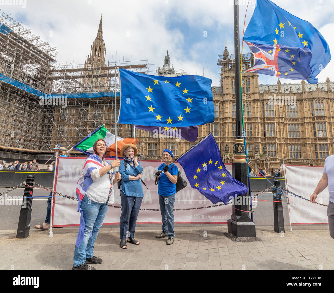 London / UK - June 26th 2019 - Pro-EU anti-Brexit protesters holding European Union flags outside Parliament in Westminster Stock Photo