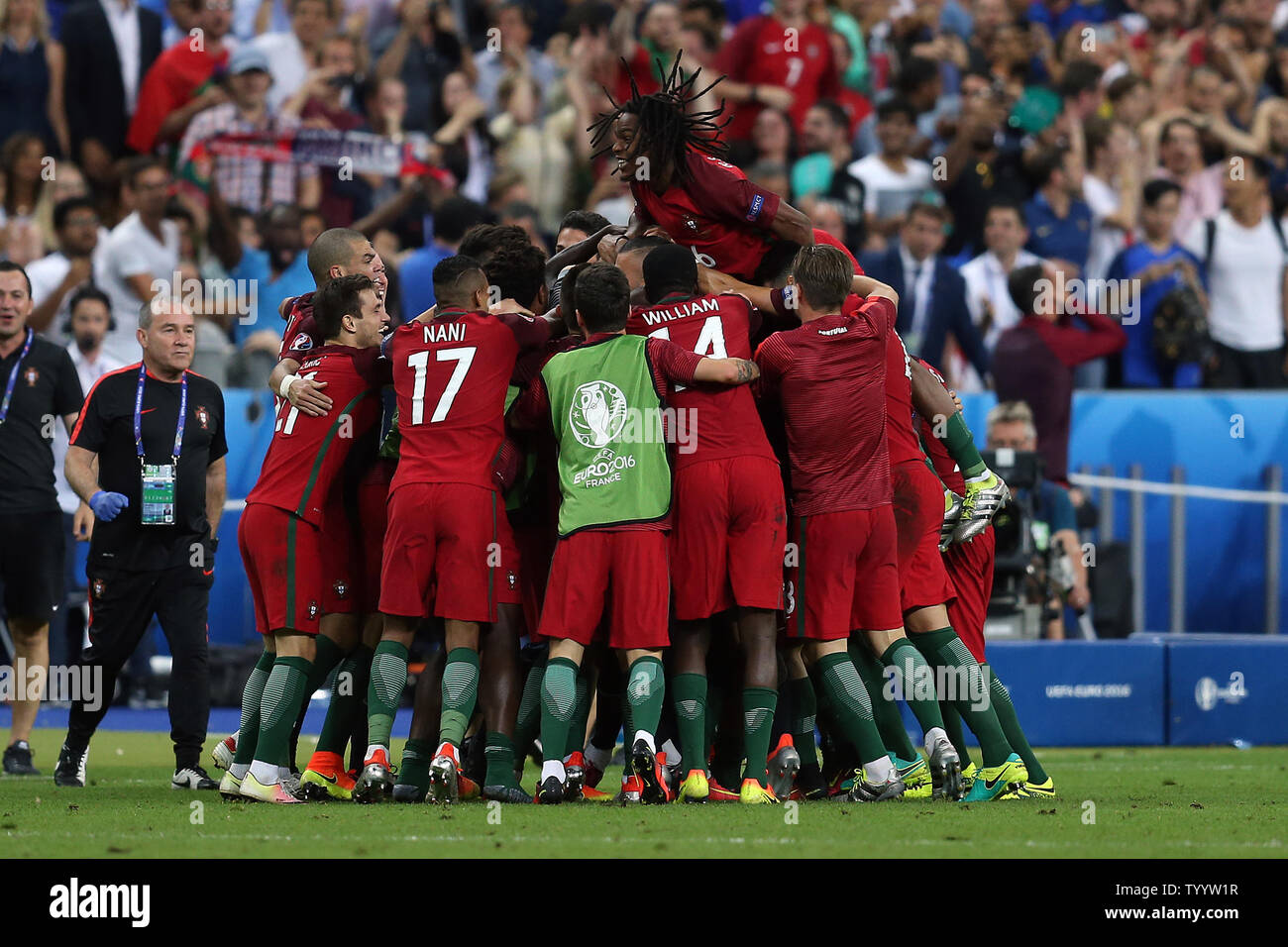 Eder of Portugal is mobbed by his team-mates after scoring the winning goal during the Euro 2016 Final match at the Stade de France in Paris, France on July 10, 2016. Portugal beat France 1-0 after extra-time to secure their first European Championship. Photo by Chris Brunskill/UPI Stock Photo