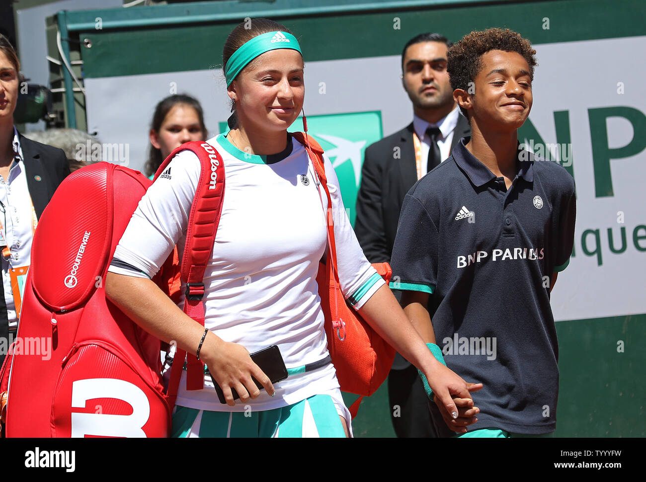 Jelena Ostapenko Of Latvia Enters The Court With A Ball Boy Before Her French Open Women S Final Match Against Simona Halep Of Romania At Roland Garros In Paris On June 10 17