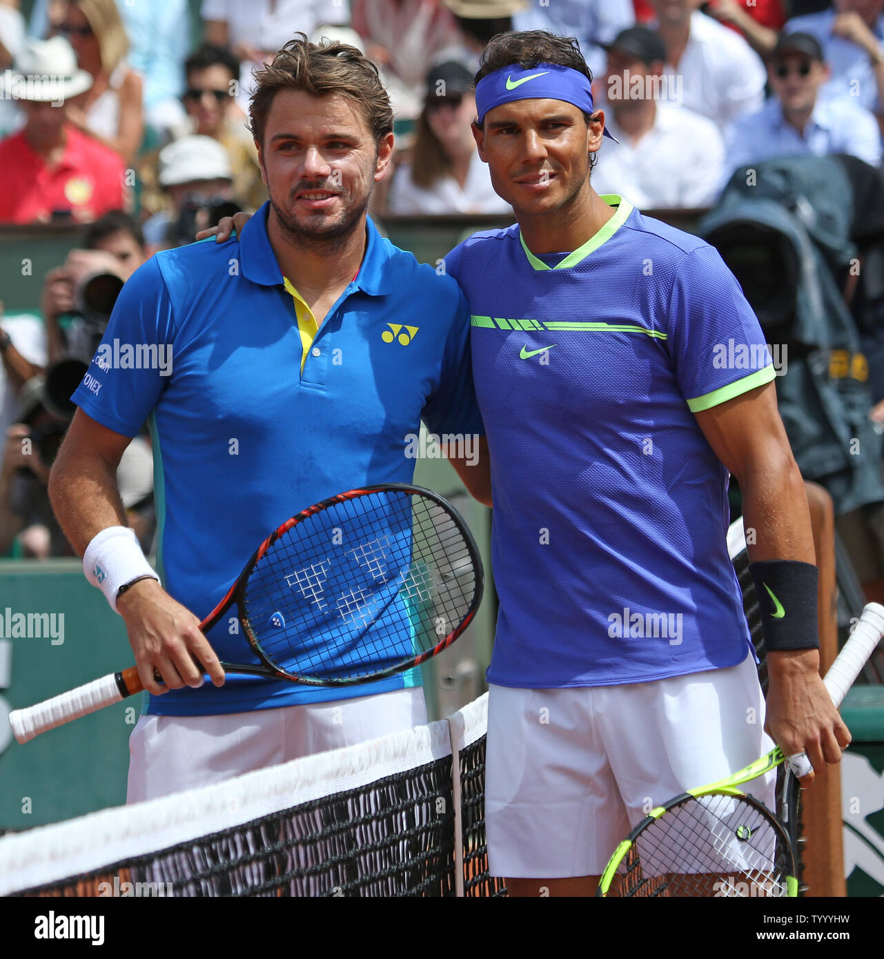 Stan Wawrinka (L) of Switzerland and Rafael Nadal of Spain meet at the net  before their French Open men's final match at Roland Garros in Paris on  June 11, 2017. Photo by