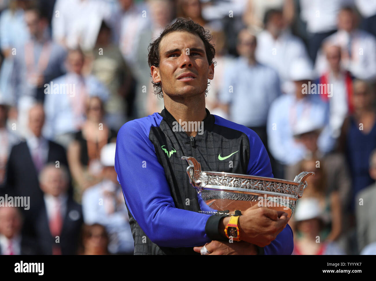 Rafael Nadal of Spain holds the championship trophy after winning his French  Open men's final match against Stan Wawrinka of Switzerland at Roland Garros  in Paris on June 11, 2017. Nadal defeated