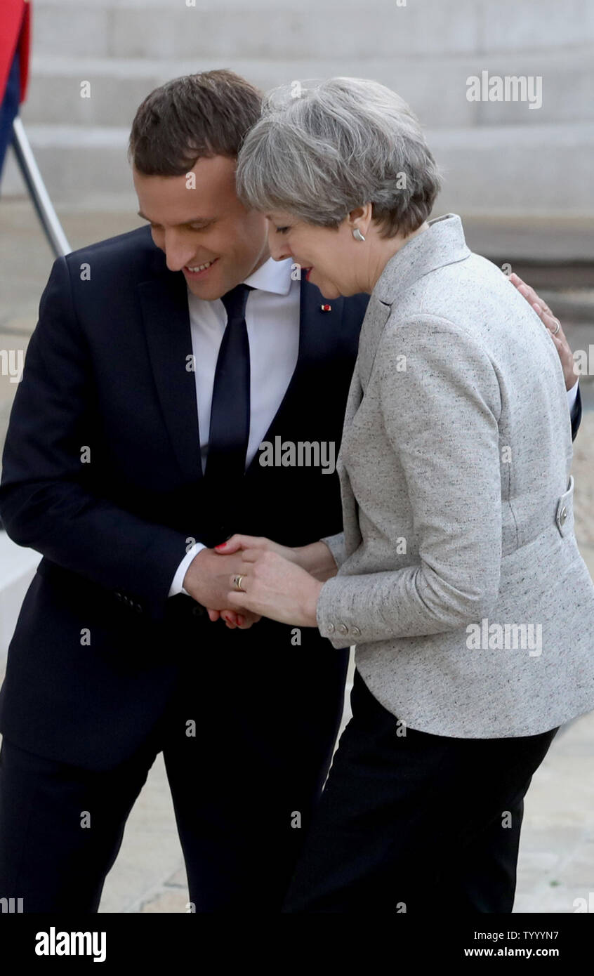 French President Emmanuel Macron (L) greets British Prime Minister Theresa May on the steps of the Elysee Palace in Paris on June 13, 2017. The two discussed said they will launch a joint campaign to tackle online radicalization. Photo by Maya Vidon-White/UPI Stock Photo