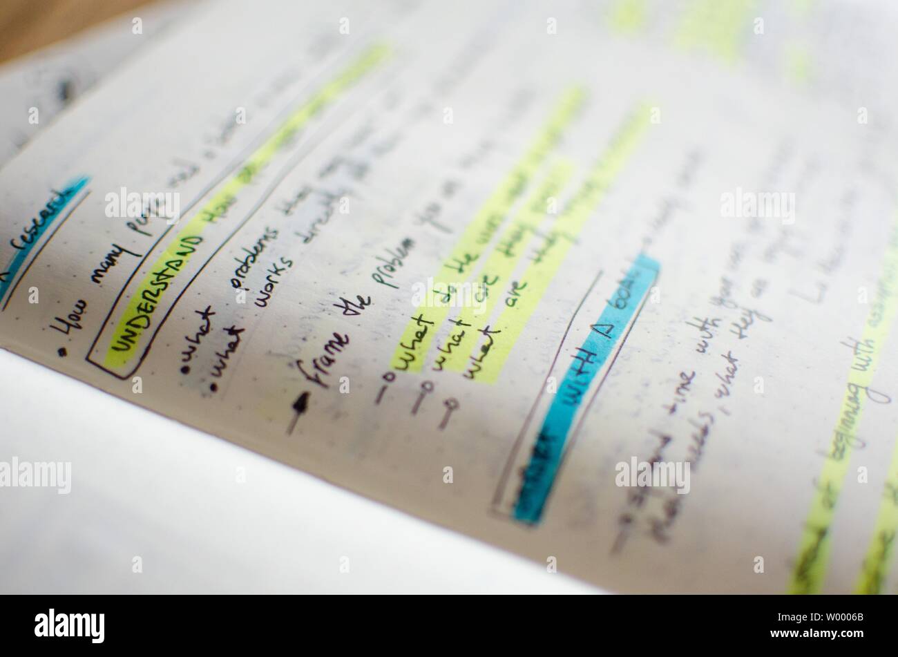 Closeup of UI/UX draft sheet with highlighted areas with a magic marker ...