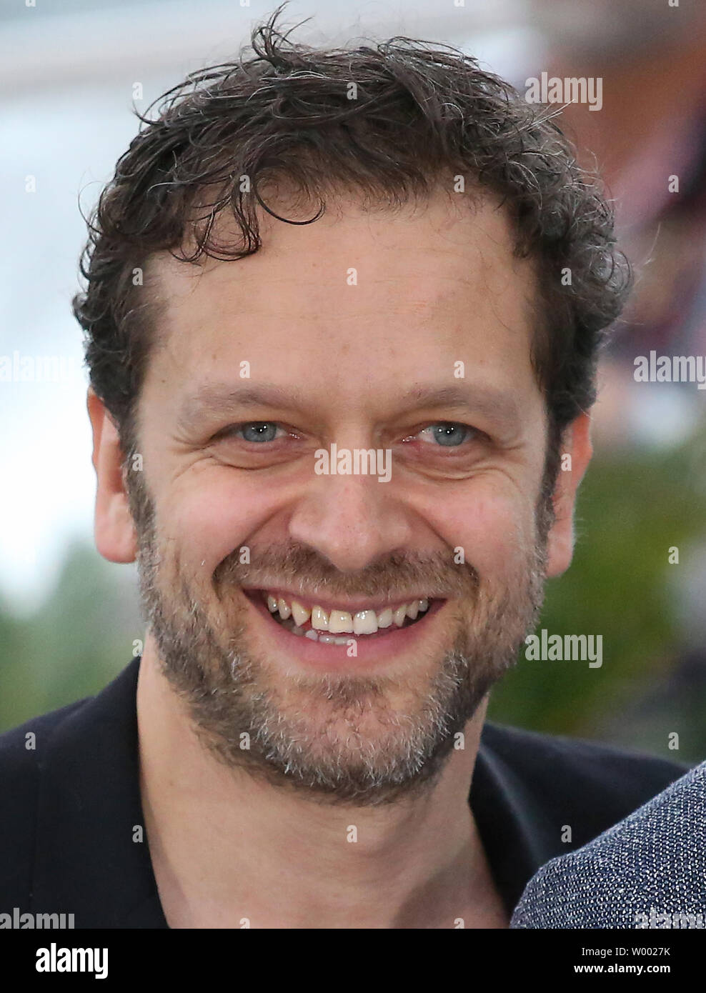 Jonathan Zaccai arrives at a photocall for the film “Le grand bain