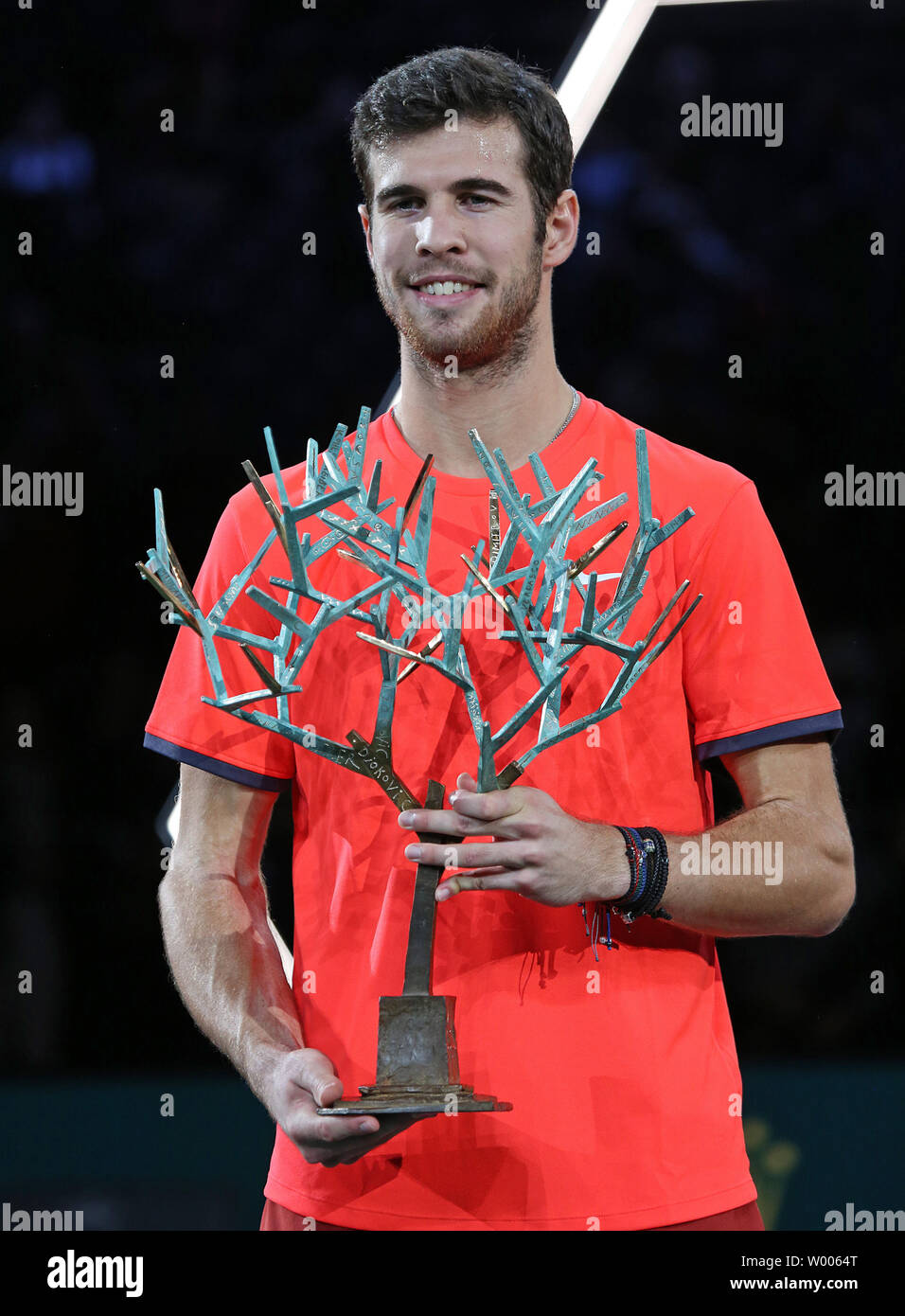 Russian Karen Khachanov holds the championship trophy after winning his  finals match against Novak Djokovic of Serbia at the Rolex Paris Masters  tennis in Paris on November 4, 2018. Khahchanov defeated Djokovic