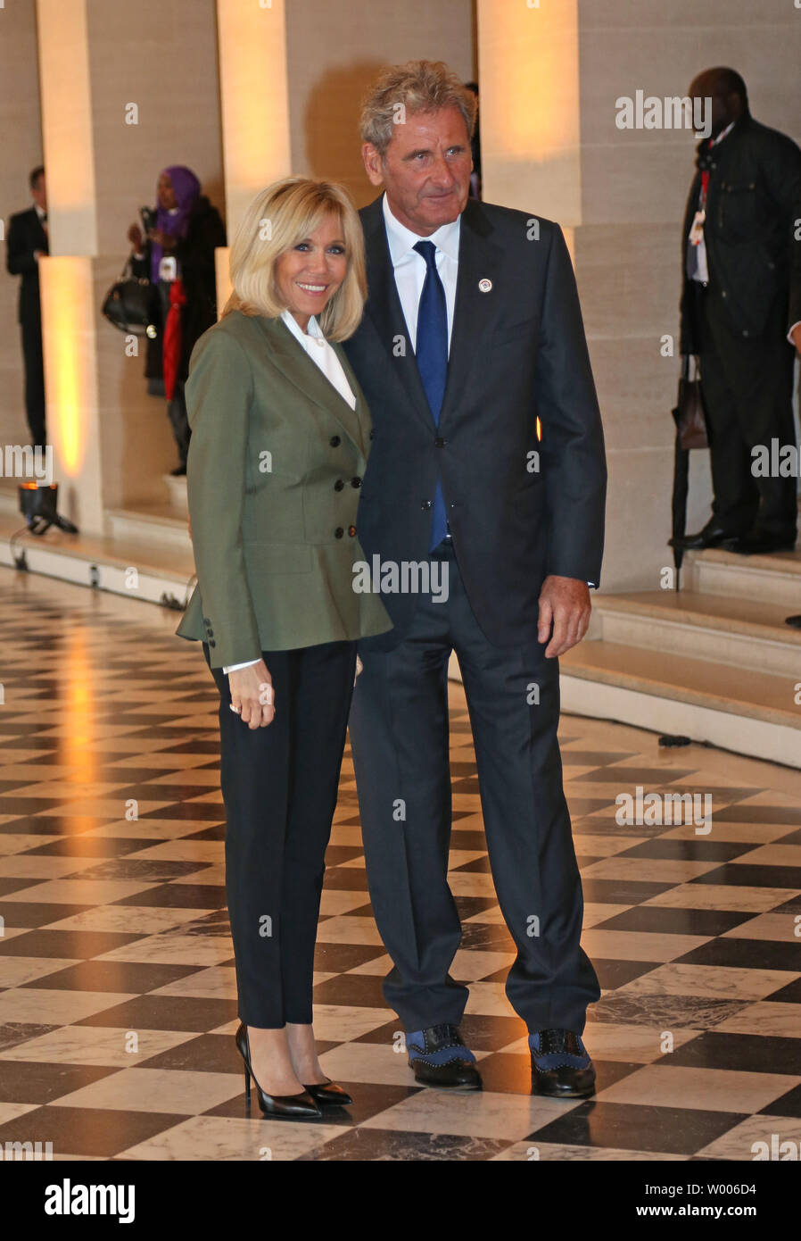 Brigitte Macron (L), wife of French President Emmanuel Macron, greets International Monetary Fund Managing Director Christine Lagarde's partner Xavier Giocanti at the Palace of Versailles near Paris on November 11, 2018. Macron is hosting a lunch and concert for spouses of the heads of state as part of the ceremonies marking the 100th anniversary of the end of World War I.   Photo by David Silpa/UPI Stock Photo