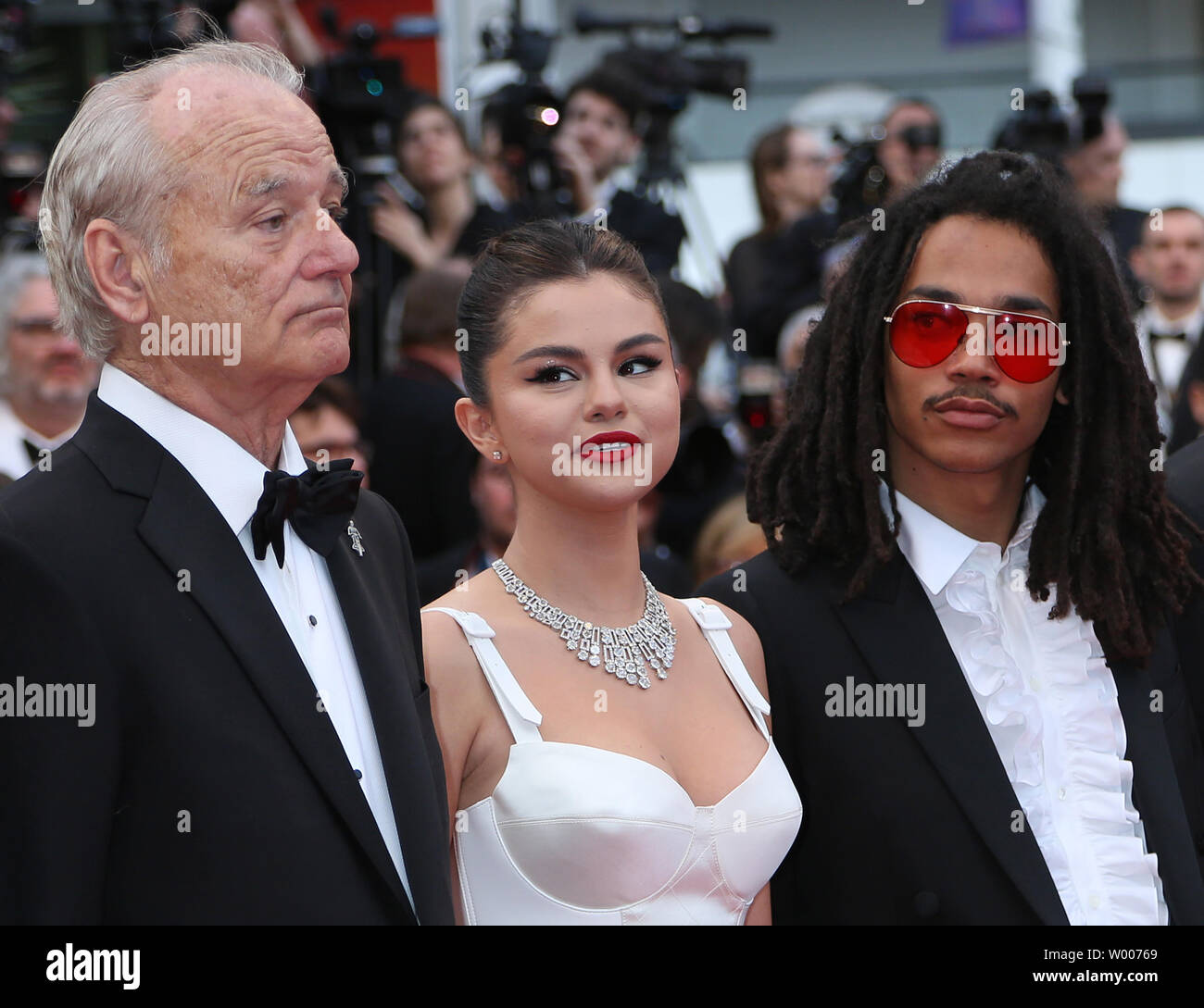 Bill Murray (L), Selena Gomez (C) and Luka Sabbat arrive on the red carpet before the screening of the film 'The Dead Don't Die' at the opening of the 72nd annual Cannes International Film Festival in Cannes, France on May 14, 2019.  Photo by David Silpa/UPI Stock Photo