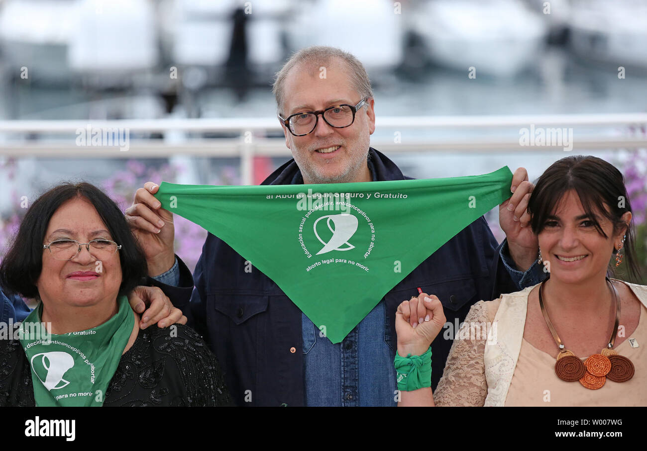 Juan Solanas (2-R) and cast members arrive at a photocall for the film 
