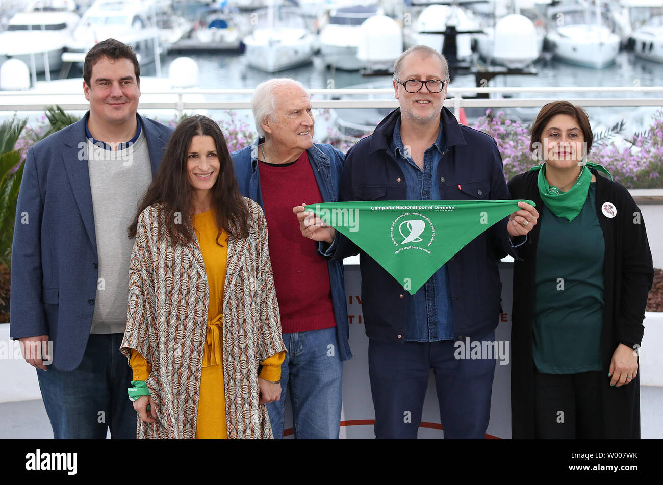 Juan Solanas (2-R) and cast members arrive at a photocall for the film 