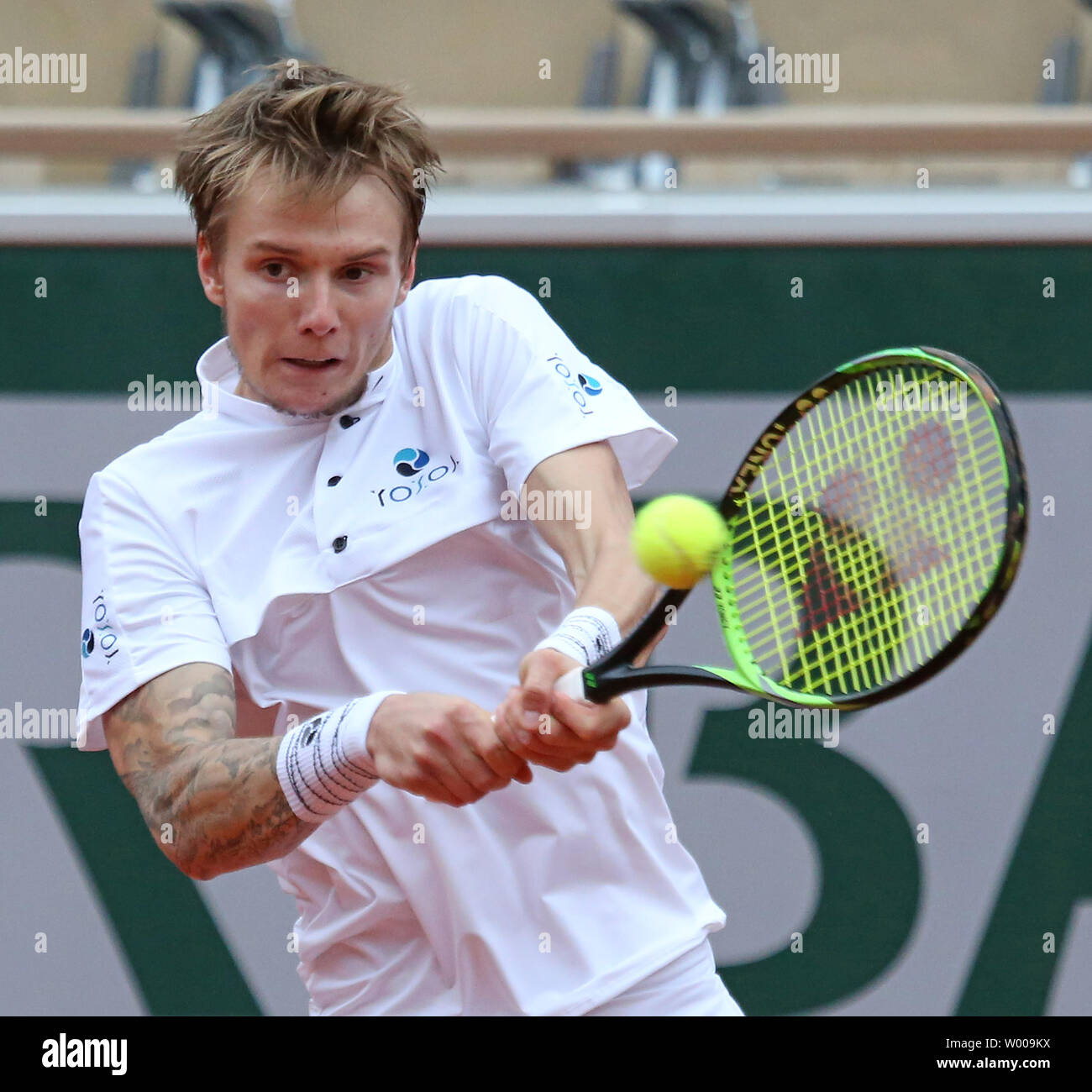 Alexander Bublik of Kazakhstan hits a shot during his French Open men's  second round match against Dominic Thiem of Austria at Roland Garros in  Paris on May 30, 2019. Thiem defeated Bublik
