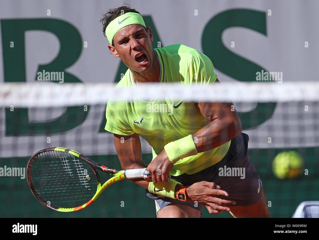 Rafael Nadal of Spain hits a serve during his French Open men's third round  match against David Goffin of Belgium at Roland Garros in Paris on May 31,  2019. Nadal defeated Goffin