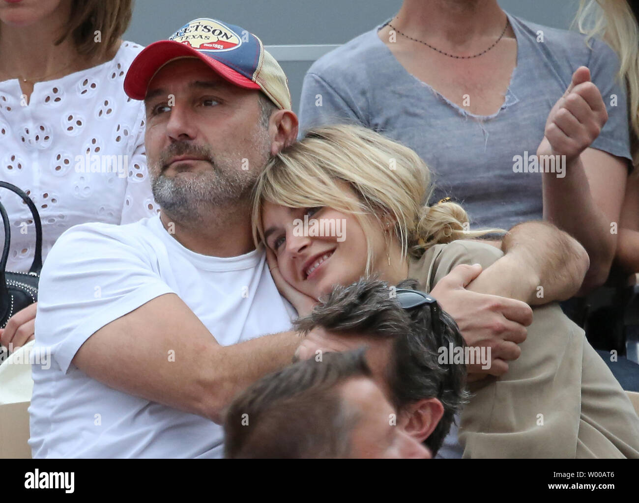 Gilles Lellouche (L) and Alizee Guinochet watch the French Open men's final match between Rafael Nadal of Spain and Dominic Thiem of Austria at Roland Garros in Paris on June 9, 2019. Nadal defeated Thiem 6-3, 5-7, 6-1, 6-1 to win his 12th French Open championship.   Photo by David Silpa/UPI Stock Photo