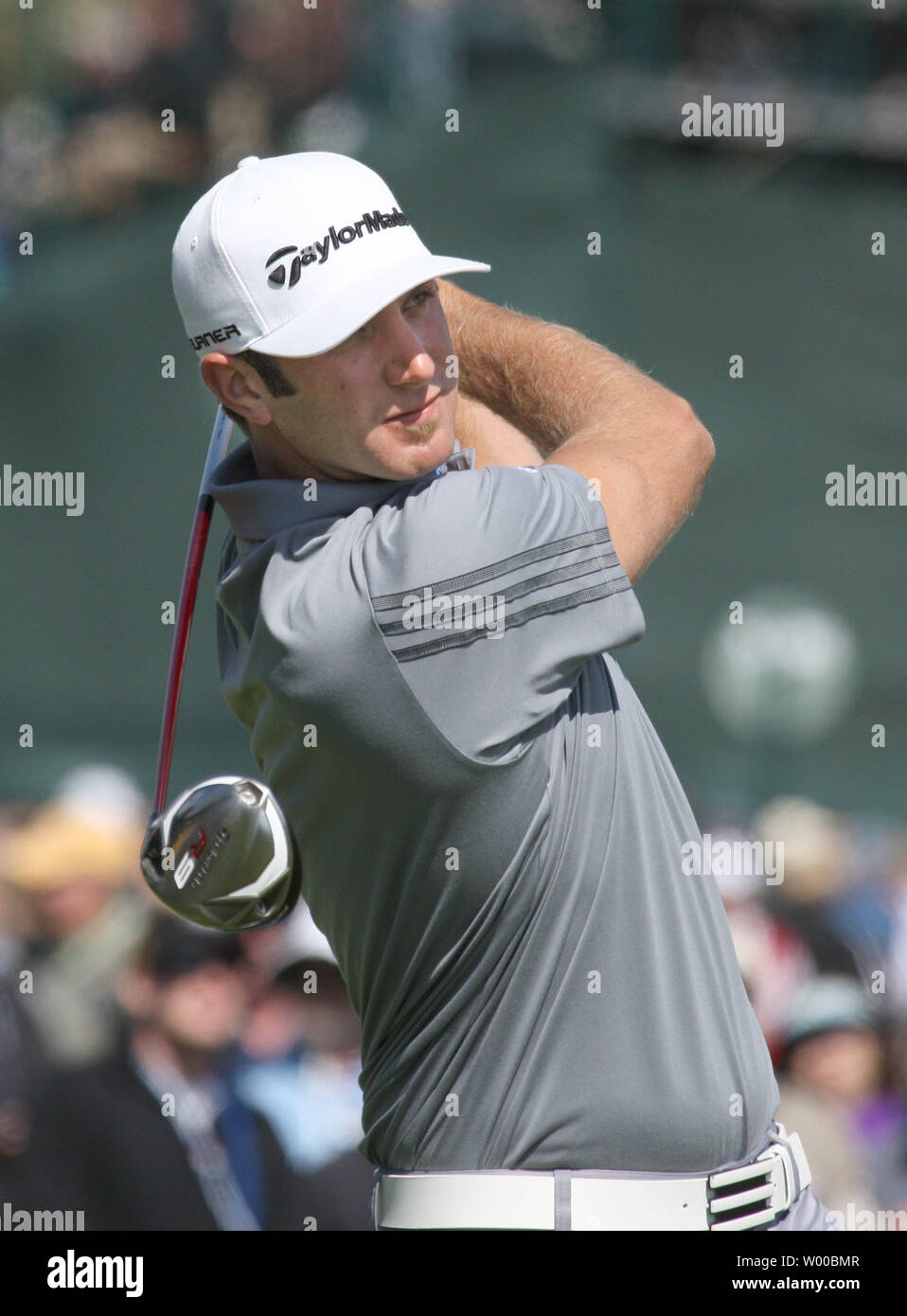 Dustin Johnson drives off the third tee on the day three of the U.S. Open in Pebble Beach