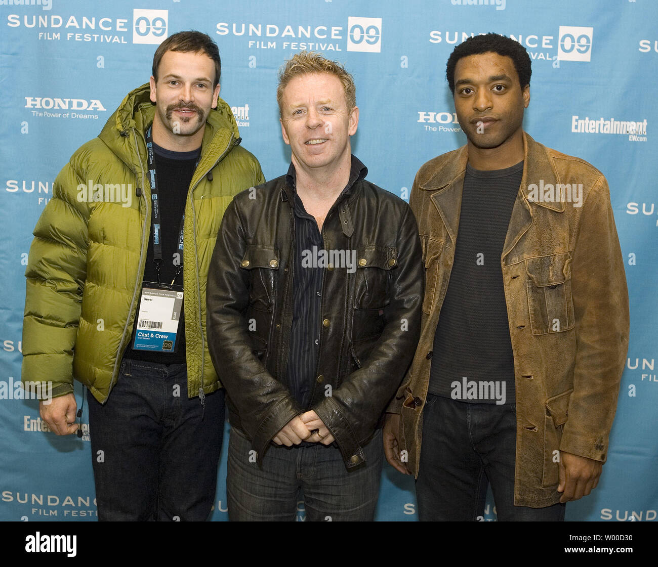 (L-R) Johnny Lee Miller, Director Pete Travis, and Chiwetel Ejiofor attend the premiere of 'Endgame' at the 2009 Sundance Film Festival in Park City, Utah on January 18, 2009. The festival is celebrating its 25th anniversary.   (UPI Photo/Gary C. Caskey) Stock Photo