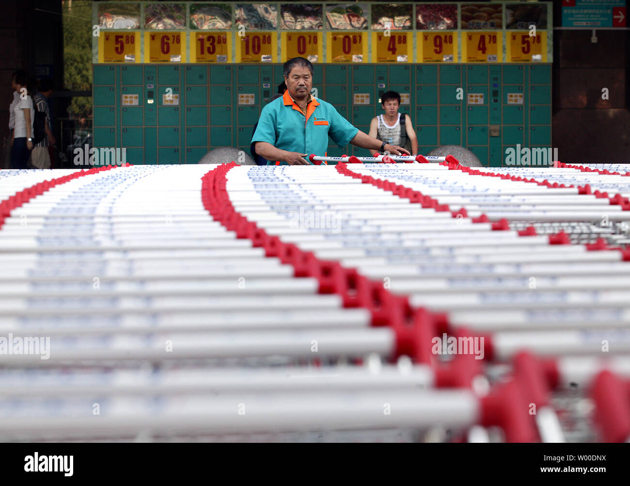 Hundreds of shopping carts are parked outside a normally busy shopping center in Beijing on June 16, 2009.  Many of the city's major shopping malls have experienced a sharp decline in customers due to the country's economic slow down.    (UPI Photo/Stephen Shaver) Stock Photo