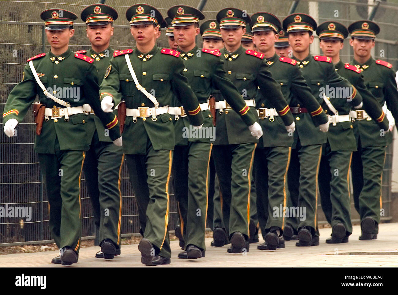 Chinese People's Liberation Army Soldiers (PLA) march through the embassy area of Beijing, China on March 17, 2006.  US Secretary of State Condoleezza Rice put pressure on China over its military build-up and praised Indian democracy on Thursday ahead of controversial security talks with Japan and Australia.  Ms Rice was speaking at a news conference here after meeting Australian Foreign Minister Alexander Downer and ahead of a new trilateral security dialogue with Japan on Saturday, at which China's growing power is top of the agenda.  (UPI Photo/Stephen Shaver) Stock Photo