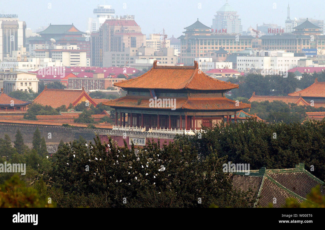 Beijing's Forbidden City is surrounded by the city's continually changing urban skyline, August 17, 2006  Beijing's race toward urban development and modernization has robbed China's capital of much of its cultural uniqueness as traditional architecture and living areas are replaced by massive commercial and residential complexes.  (UPI Photo/Stephen Shaver) Stock Photo